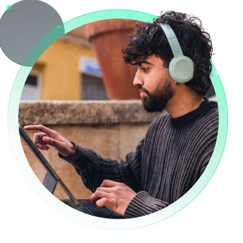 Man working outside an office on a tablet