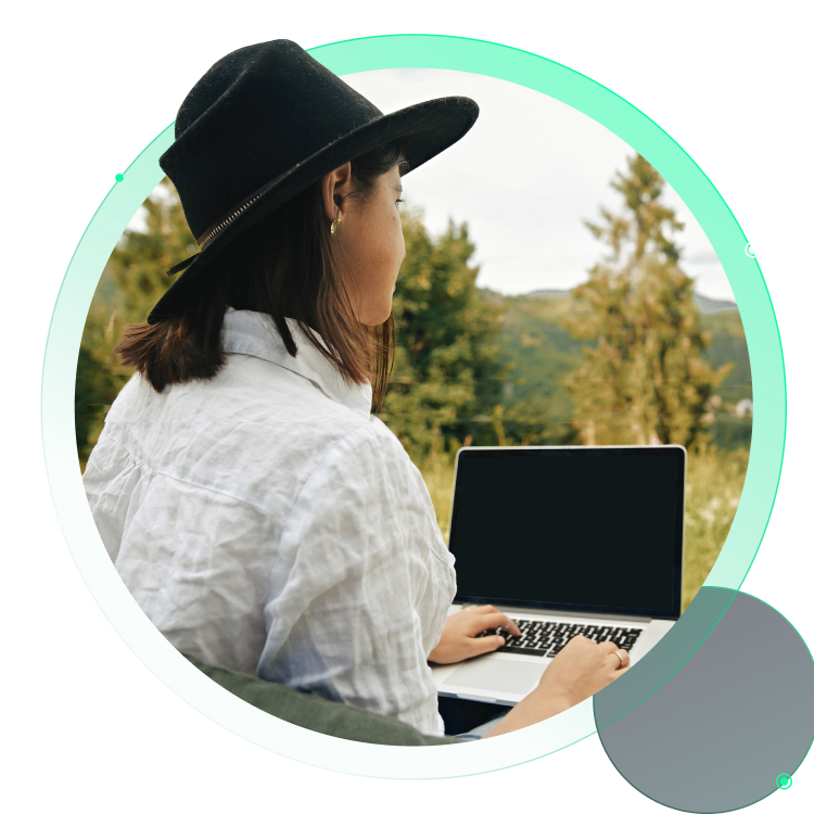 Endpoint Risk Monitoring Here featuring a woman working remotely